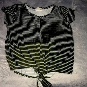 A crop top Army green shirt with knot at end.